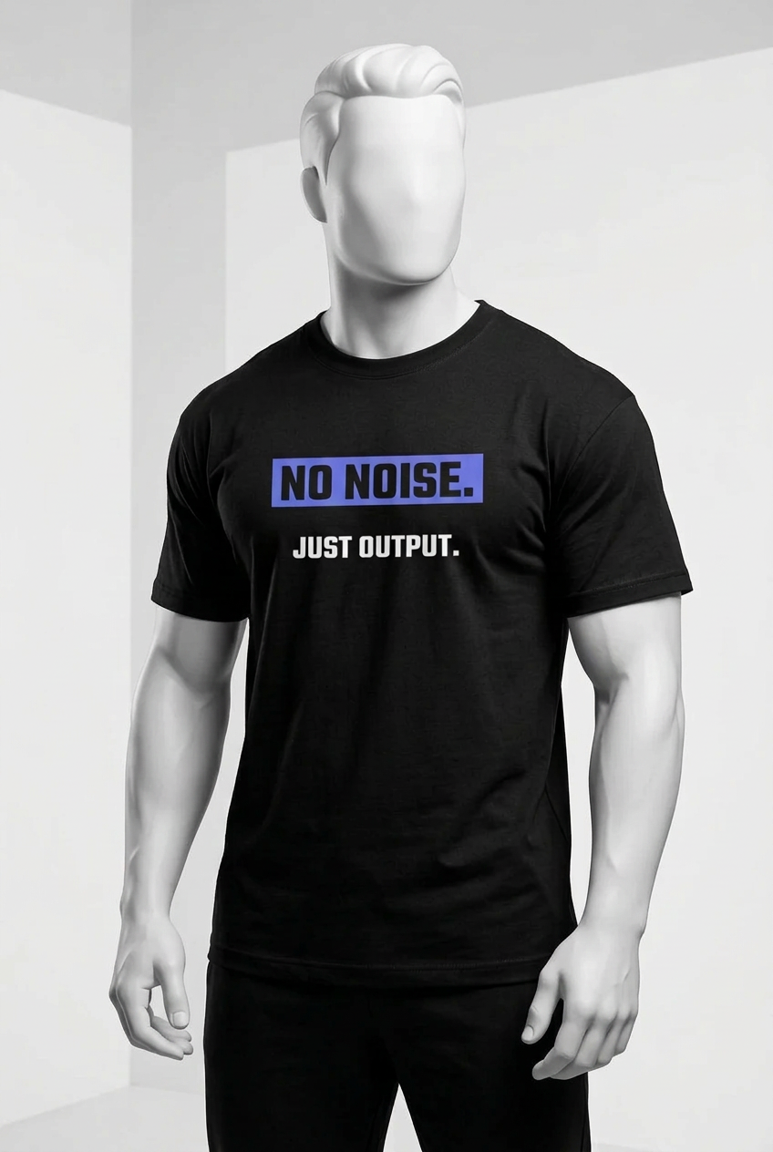 A muscular man wearing a black t-shirt with the text 'NO NOISE. JUST OUTPUT.